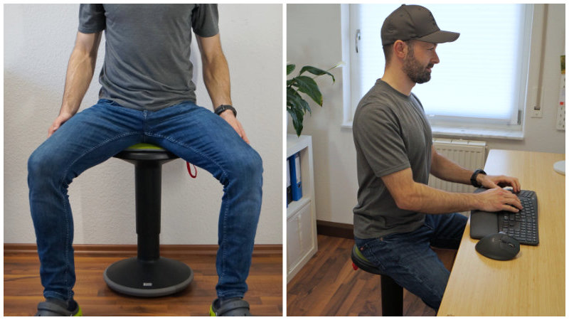 Person zeigt, wie man auf dem Bürohocker bzw. Pendelhocker richtig sitzt